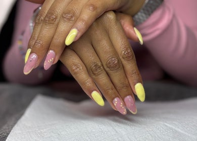 Vibrant pastel manicure at The Beauty Box, Cape Town, Western Cape, ZA. Nail art with pink and yellow tones.