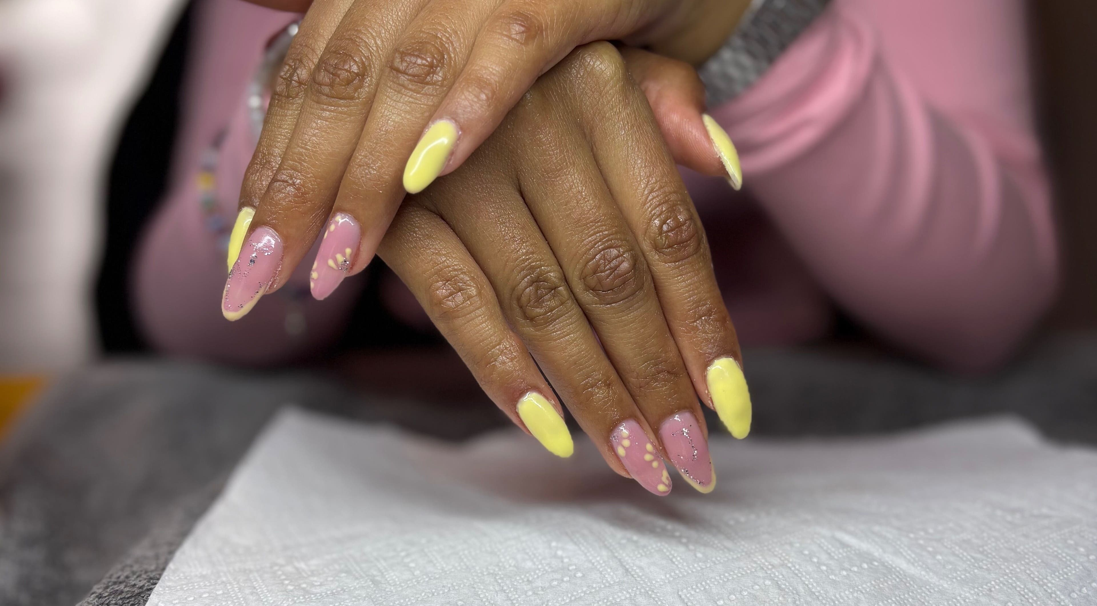 Vibrant pastel manicure at The Beauty Box, Cape Town, Western Cape, ZA. Nail art with pink and yellow tones.