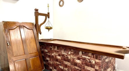 Rustic spa setting with wooden decor at The Indian Spa in Cardiff, Wales, GB promoting relaxation.