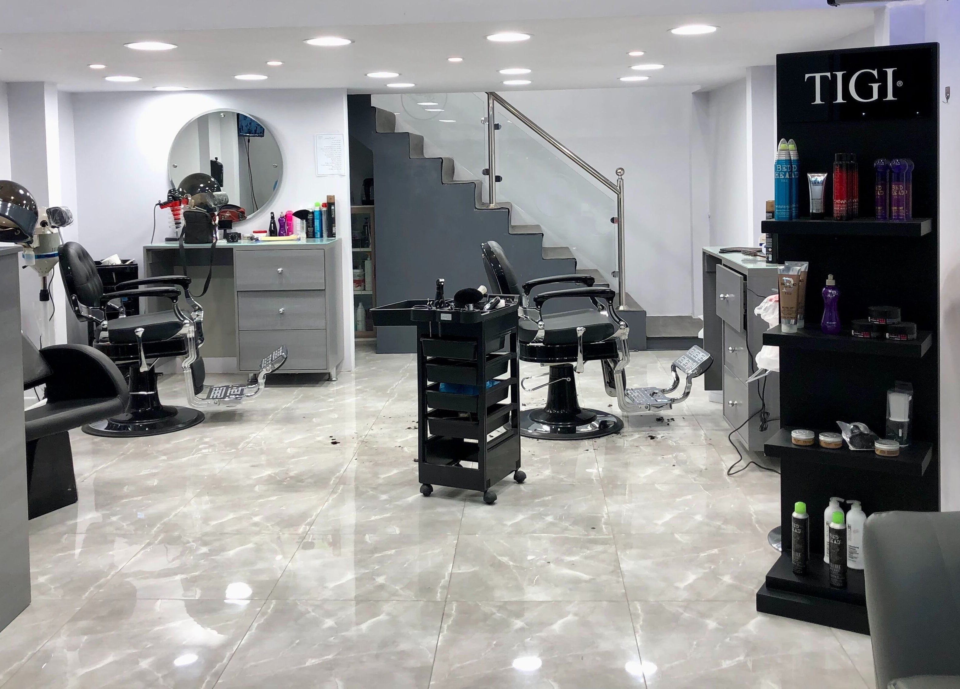 Modern salon setup at Salon and Spa Elegant, Al Mubarraz, Eastern Province, SA. Features stylish barber chairs and products.
