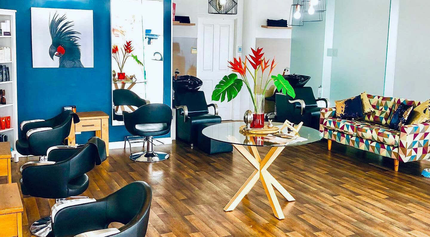 Stylish interior of Blu Boutique Hairdressing in Cairns City, Queensland, AU with modern seating and vibrant decor.
