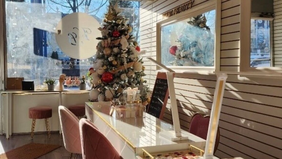 Holiday decor at View Beauty Salon and Spa, Vancouver, British Columbia, CA, with chic seating and stylish tree.