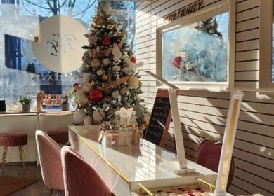 Holiday decor at View Beauty Salon and Spa, Vancouver, British Columbia, CA, with chic seating and stylish tree.