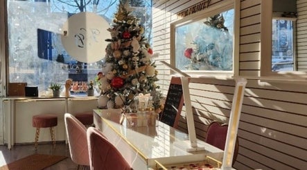 Holiday decor at View Beauty Salon and Spa, Vancouver, British Columbia, CA, with chic seating and stylish tree.
