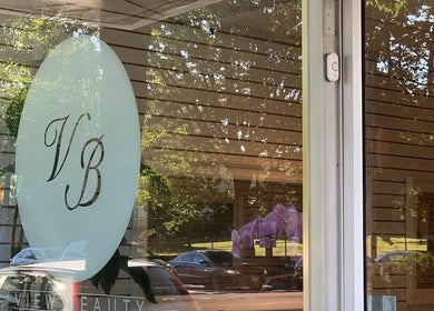 Front view of View Beauty Salon and Spa, Vancouver, British Columbia, CA with glass doors and logo.