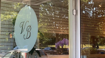 Front view of View Beauty Salon and Spa, Vancouver, British Columbia, CA with glass doors and logo.
