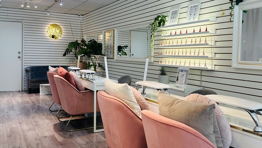 Chic interior of View Beauty Salon and Spa, Vancouver, British Columbia, CA with plush seating and nail polish display.