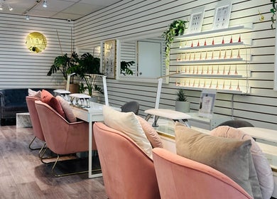 Chic interior of View Beauty Salon and Spa, Vancouver, British Columbia, CA with plush seating and nail polish display.