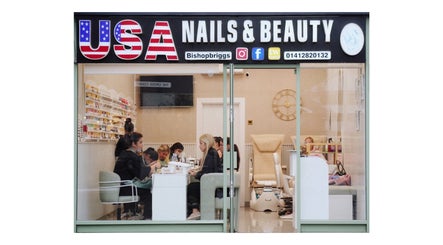 Front view of USA Nail and Beauty in Bishopbriggs, Scotland, GB, showcasing a busy salon interior.