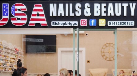 USA Nail and Beauty salon storefront in Bishopbriggs, Scotland, GB showcasing modern interior and services.