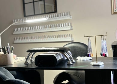 Manicure station at Eala Beauty, Northern Ireland, GB with nail polishes and tools beautifully arranged.