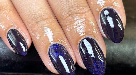 Elegant dark purple nails with glitter design at Eala Beauty, Northern Ireland, Northern Ireland, GB.