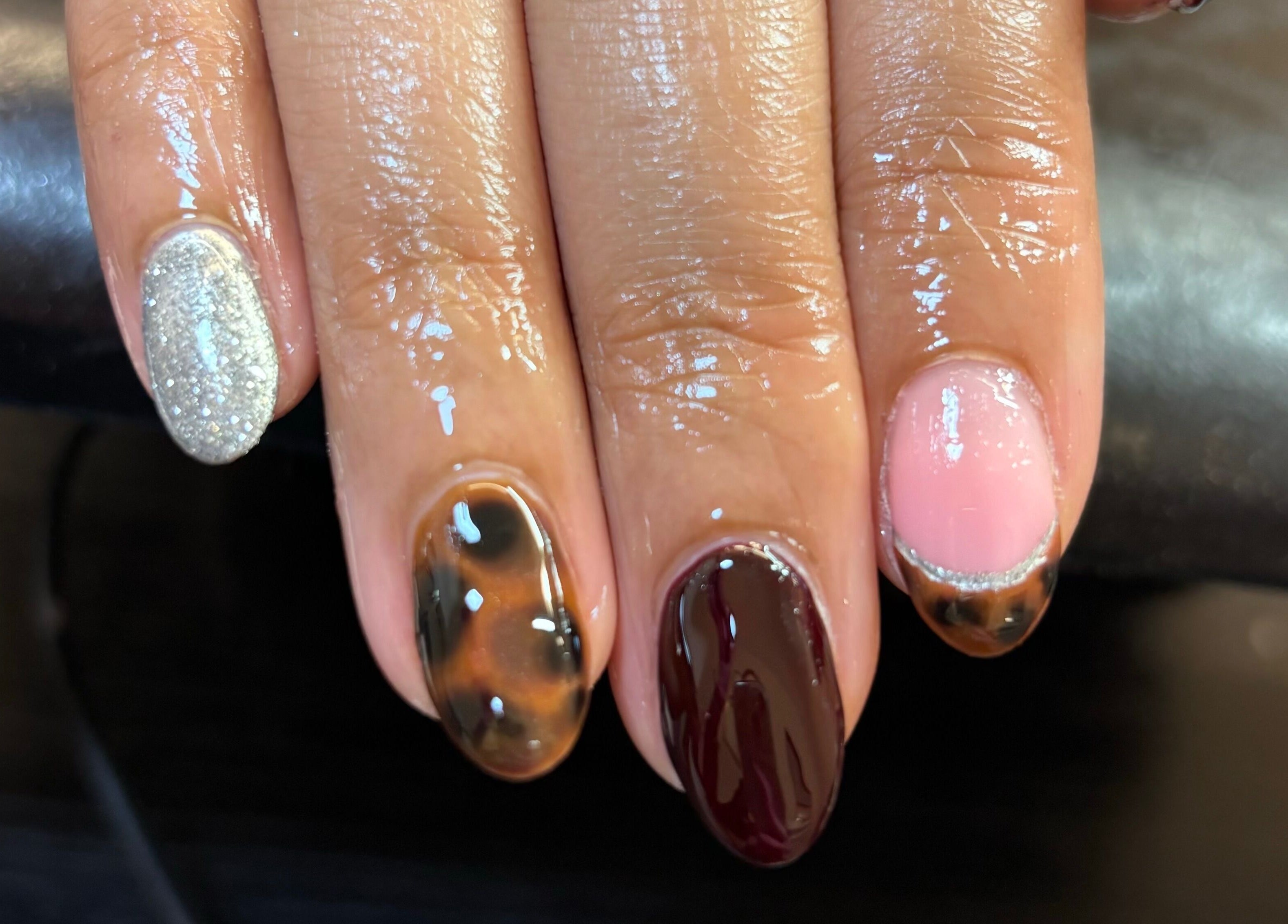 Stylish manicure showcasing diverse nail designs at Eala Beauty, Northern Ireland, Northern Ireland, GB.