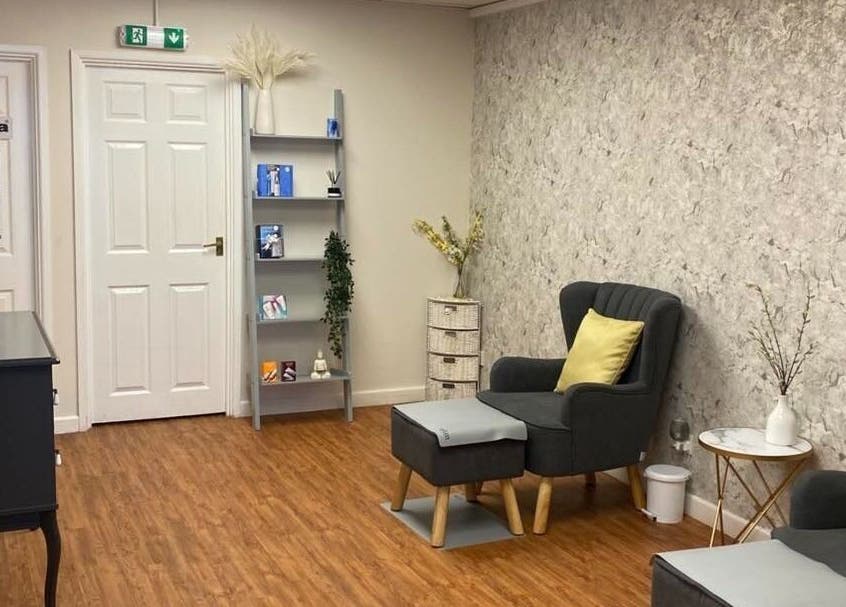 Calm waiting area at The Beauty Spot, Birmingham, England, GB, with cozy seating and modern decor.