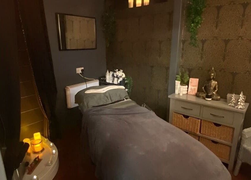 Tranquil treatment room at The Beauty Spot, Birmingham, England, GB, with soft lighting and relaxing decor.
