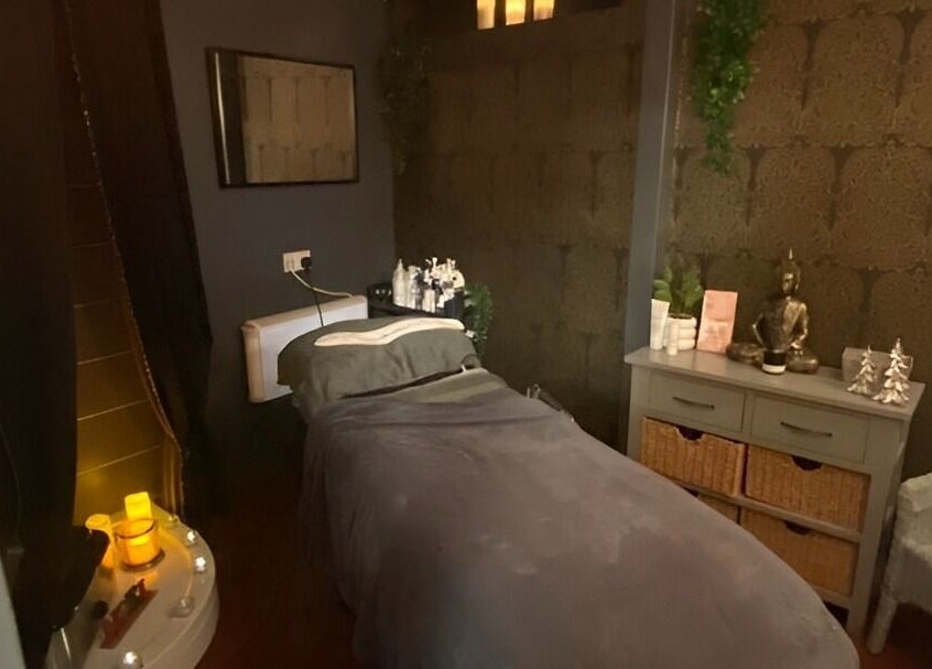 Tranquil treatment room at The Beauty Spot, Birmingham, England, GB, with soft lighting and relaxing decor.