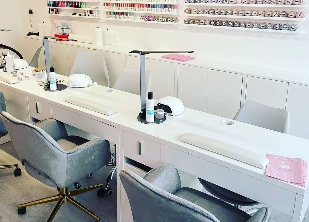 Modern nail salon setup at Lotus Nail Leopardstown, Dublin, County Dublin, IE, showcasing chic chairs and equipment.