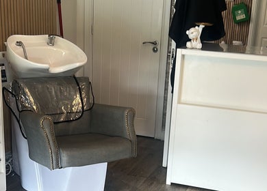 Elegant hair wash station at Arayah Beauty, Stockport, England, GB, featuring a modern basin and comfortable chair.