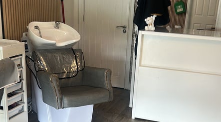 Elegant hair wash station at Arayah Beauty, Stockport, England, GB, featuring a modern basin and comfortable chair.