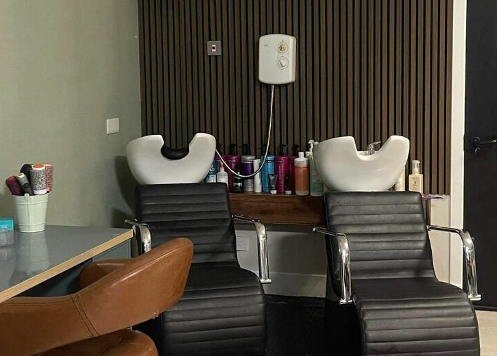 Modern salon chairs at Colours Falkirk in Falkirk, Scotland, GB offer a stylish and comfortable client experience.