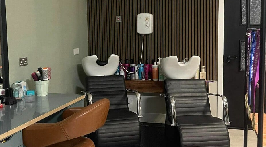Modern salon chairs at Colours Falkirk in Falkirk, Scotland, GB offer a stylish and comfortable client experience.
