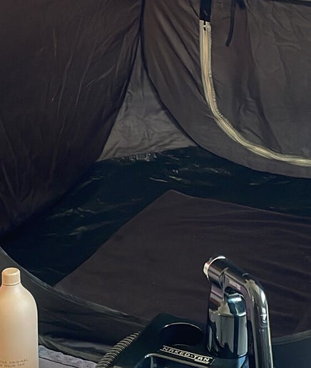 Spray tanning booth at My Beauty Haus, Fairfield, New South Wales, AU, featuring high-end products.
