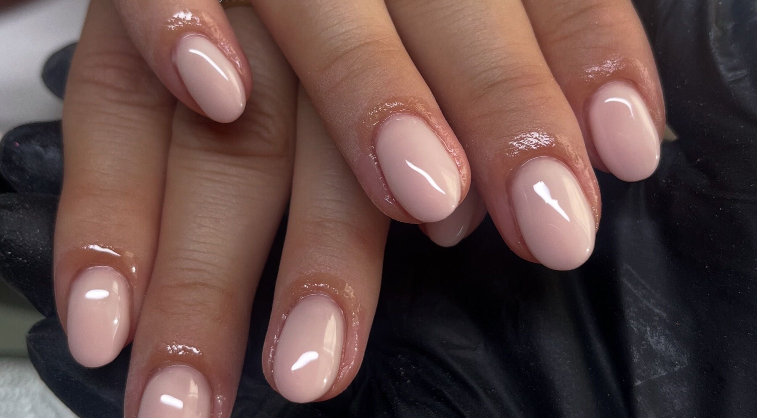 Glossy nude manicure at Claire’s Nails and Spray Tans in Colchester, GB.