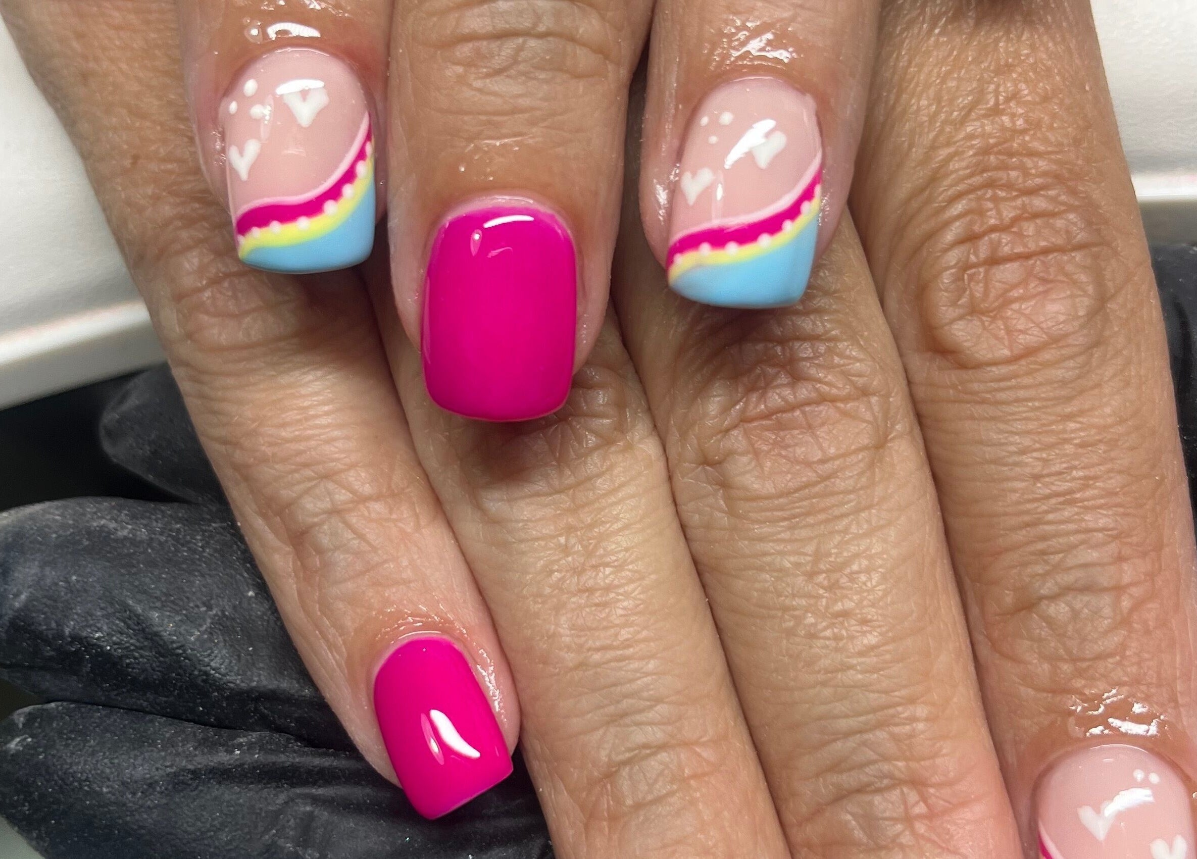 Close-up of vibrant nail art at Claire’s Nails and Spray Tans, Colchester, GB.
