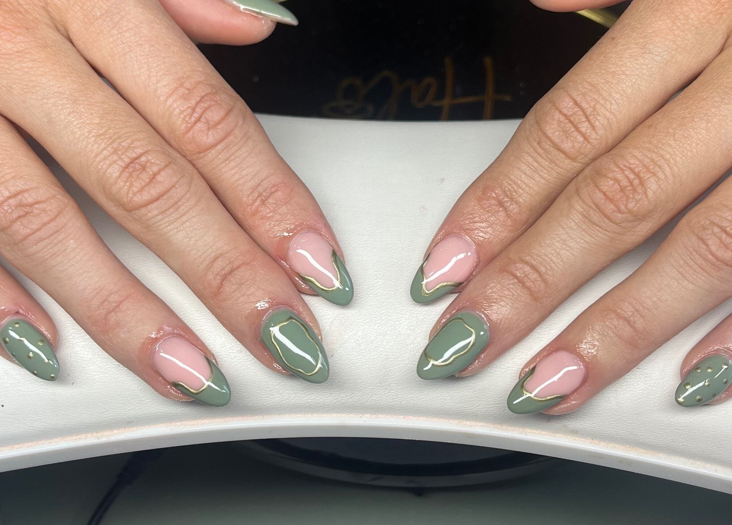 Stylish green and pink nail art at Claire’s Nails and Spray Tans, Colchester, GB.