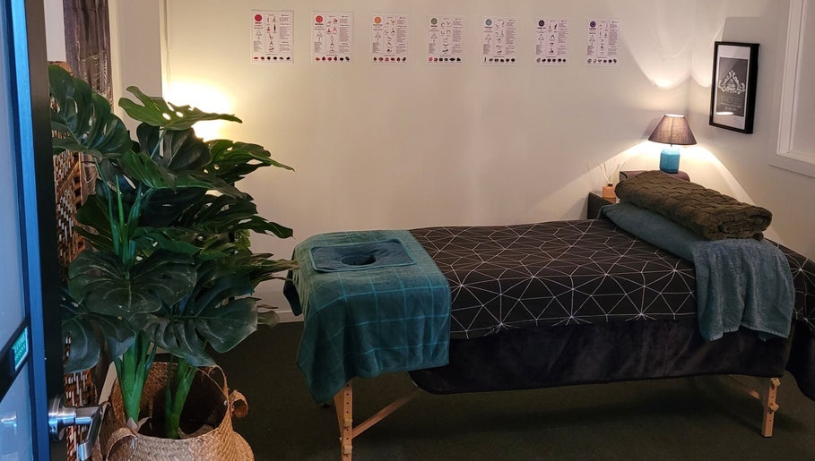 Calming massage room at Knotless in Flex Fitness Taupo, Taupō, Waikato Region, NZ with lush plants and cozy decor.