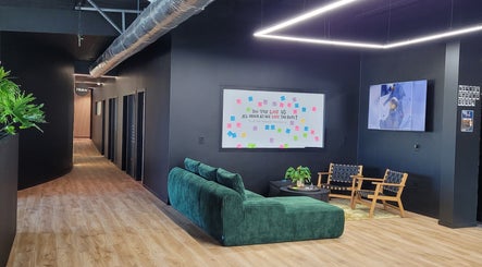Welcoming lounge at Knotless at Flex Fitness Taupo, Taupō, Waikato Region, NZ, featuring vibrant seating.