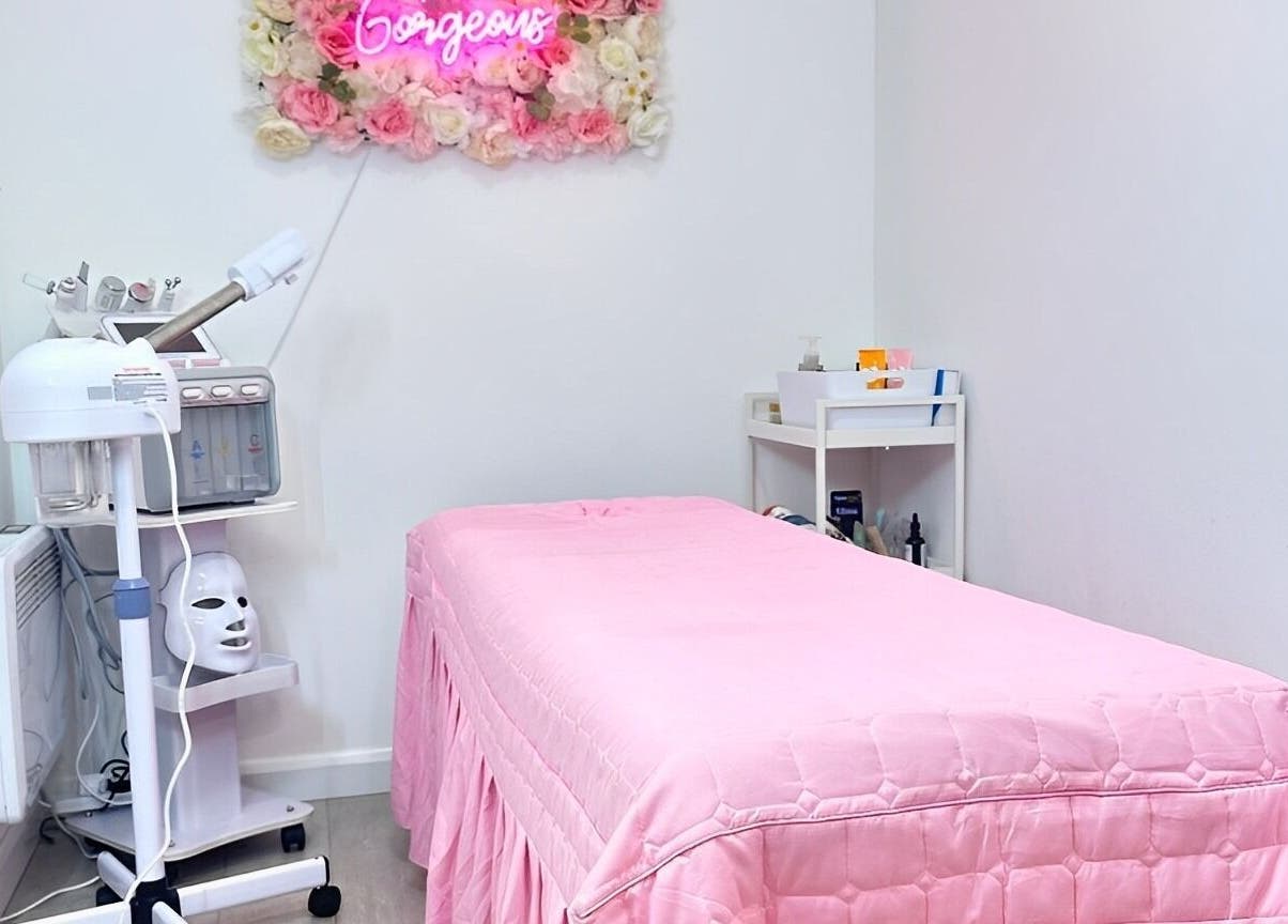 Cupping Clinic's cozy room with pink treatment bed in London, England, GB.
