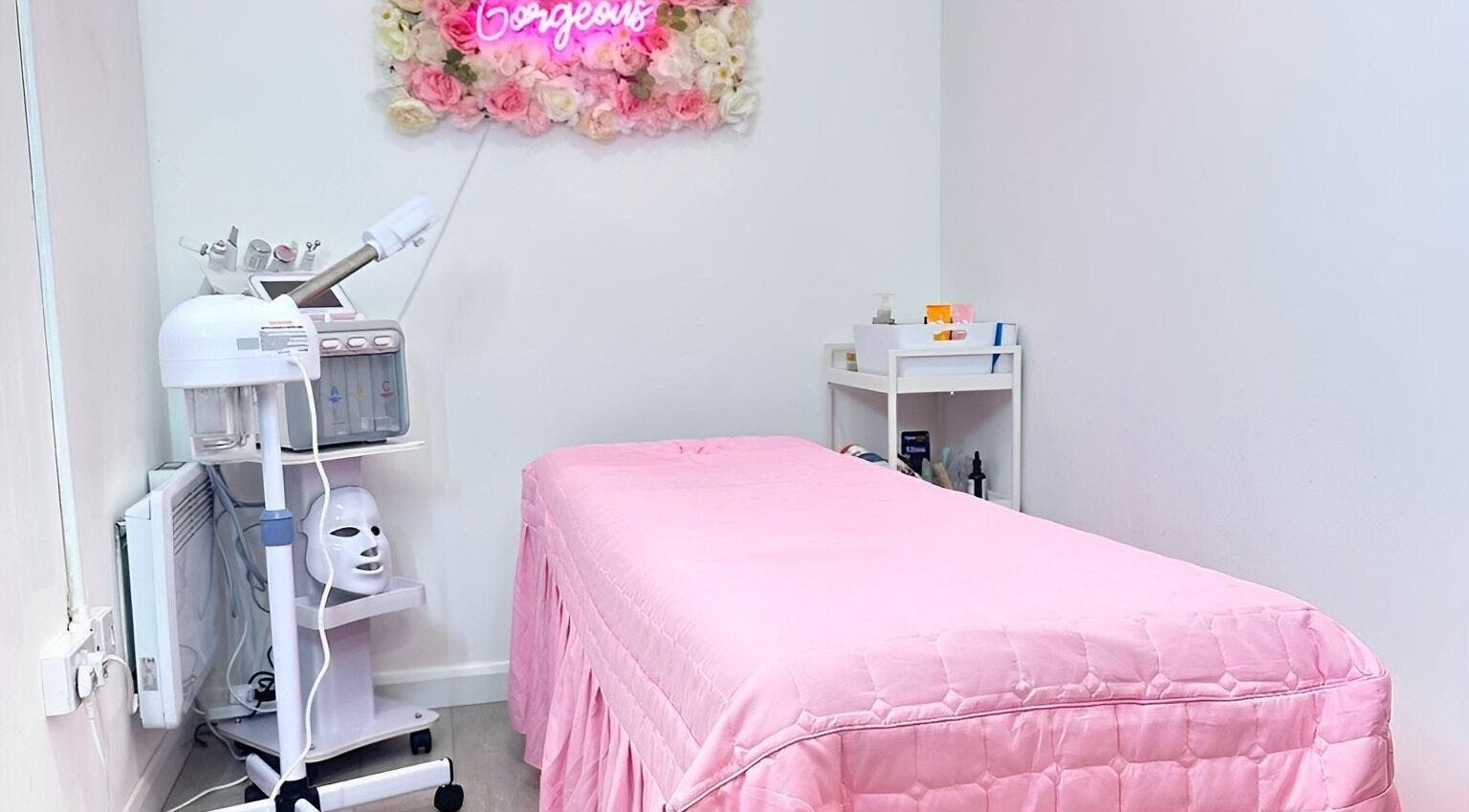 Cupping Clinic's cozy room with pink treatment bed in London, England, GB.