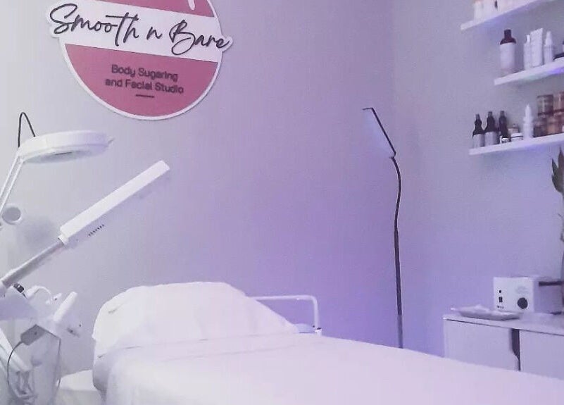 Calming treatment room at Smooth n Bare, Kingston, St. Andrew Parish, JM, featuring a therapy bed and soft lighting.