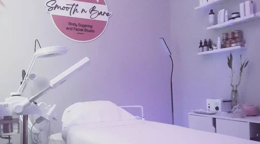 Calming treatment room at Smooth n Bare, Kingston, St. Andrew Parish, JM, featuring a therapy bed and soft lighting.