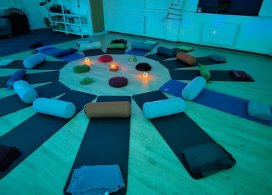 Tranquil yoga setup at Pure Turtle Wellbeing at The Pod, Burton Latimer, England, GB with round mats and cushions.