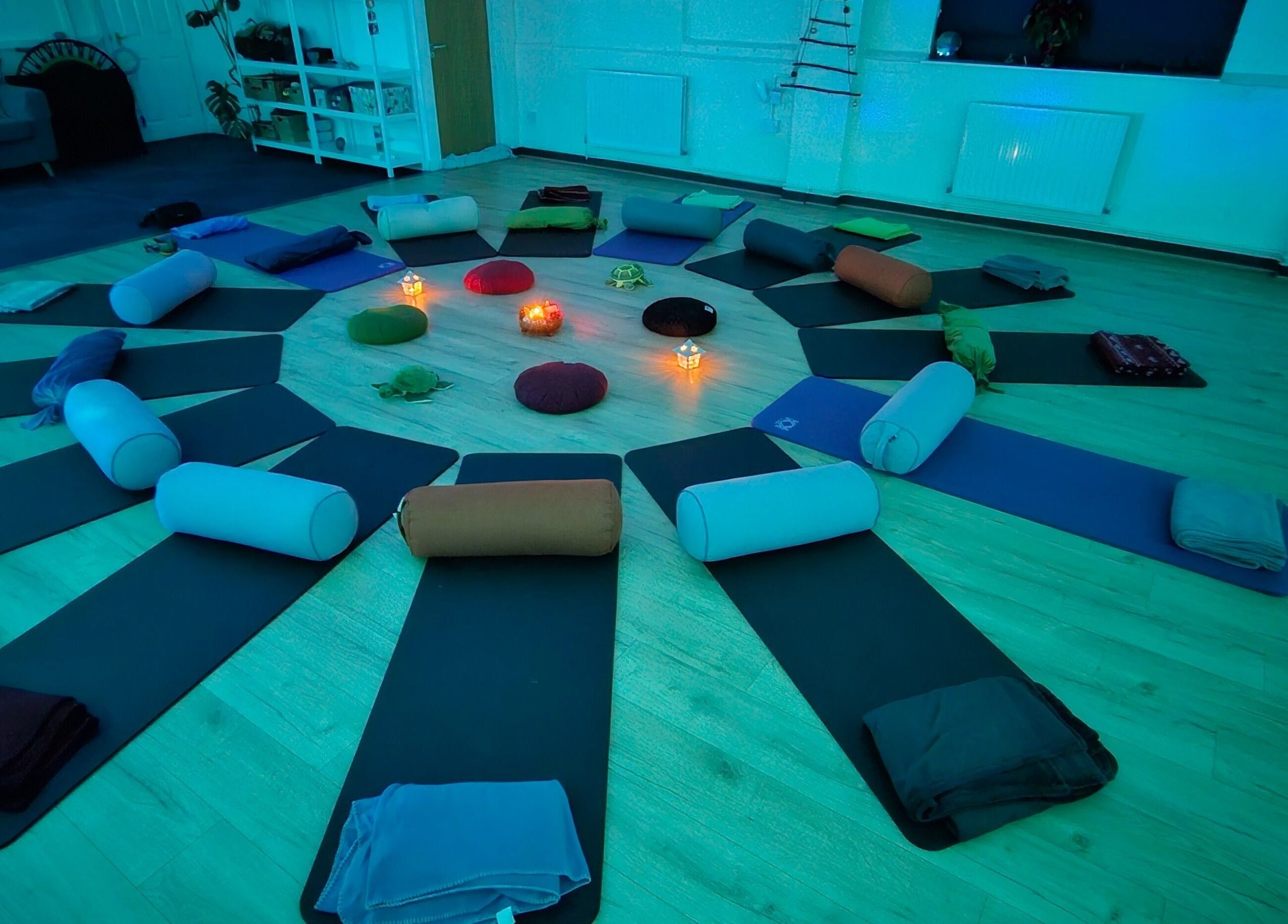 Tranquil yoga setup at Pure Turtle Wellbeing at The Pod, Burton Latimer, England, GB with round mats and cushions.