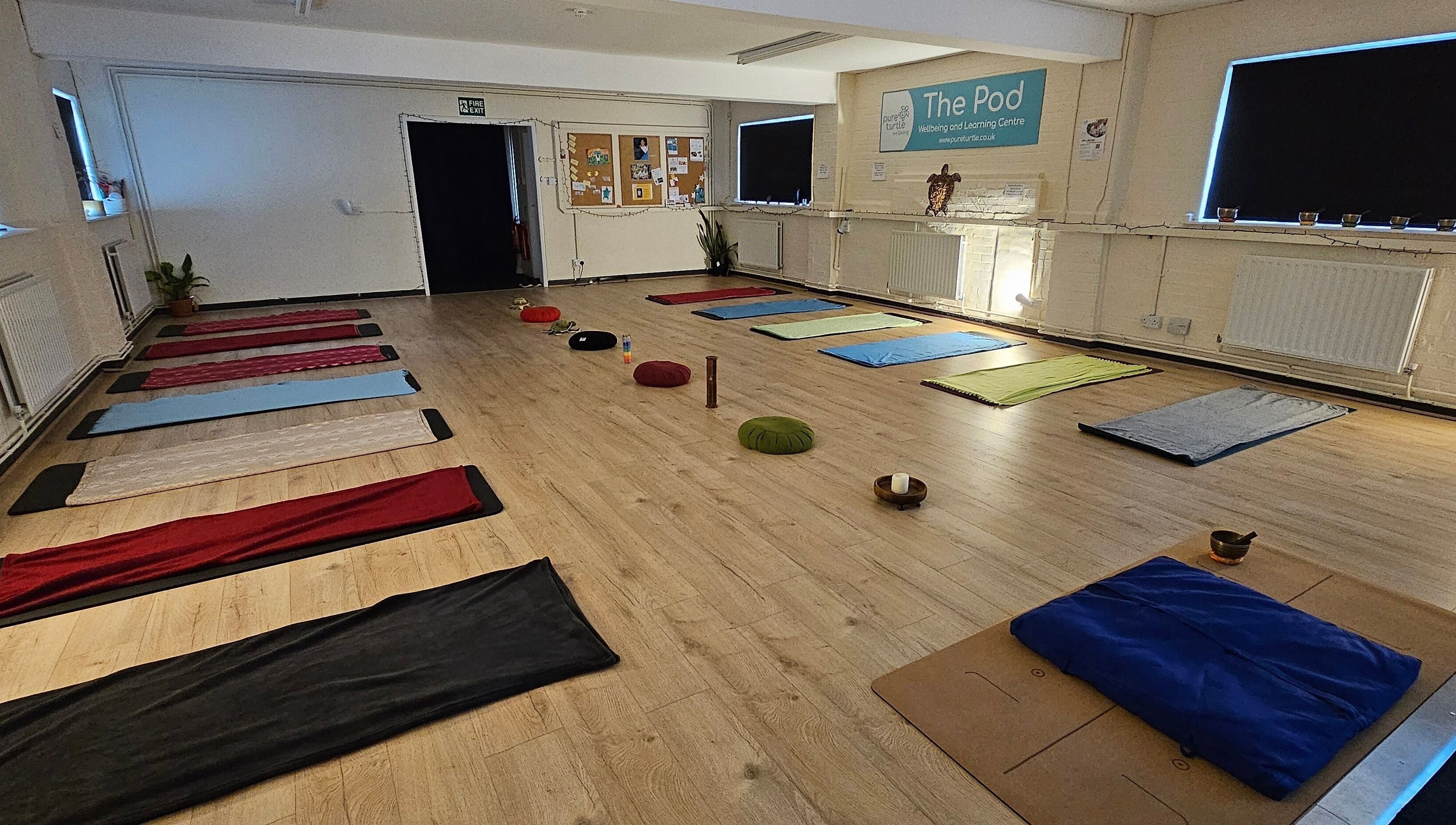 Yoga mats and cushions in serene room at Origin Wellbeing at The Pod, Burton Latimer, England, GB.