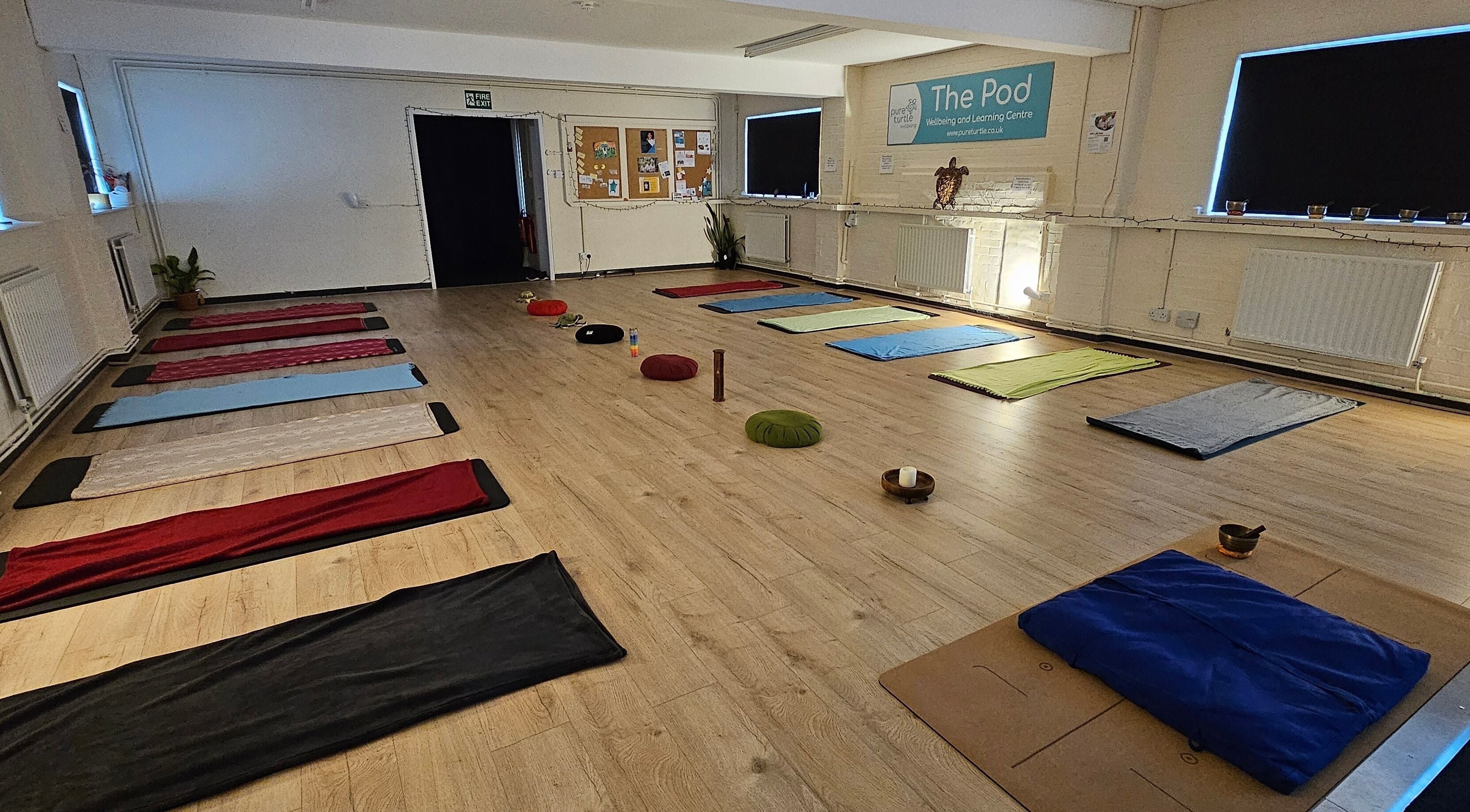 Yoga mats and cushions in serene room at Origin Wellbeing at The Pod, Burton Latimer, England, GB.