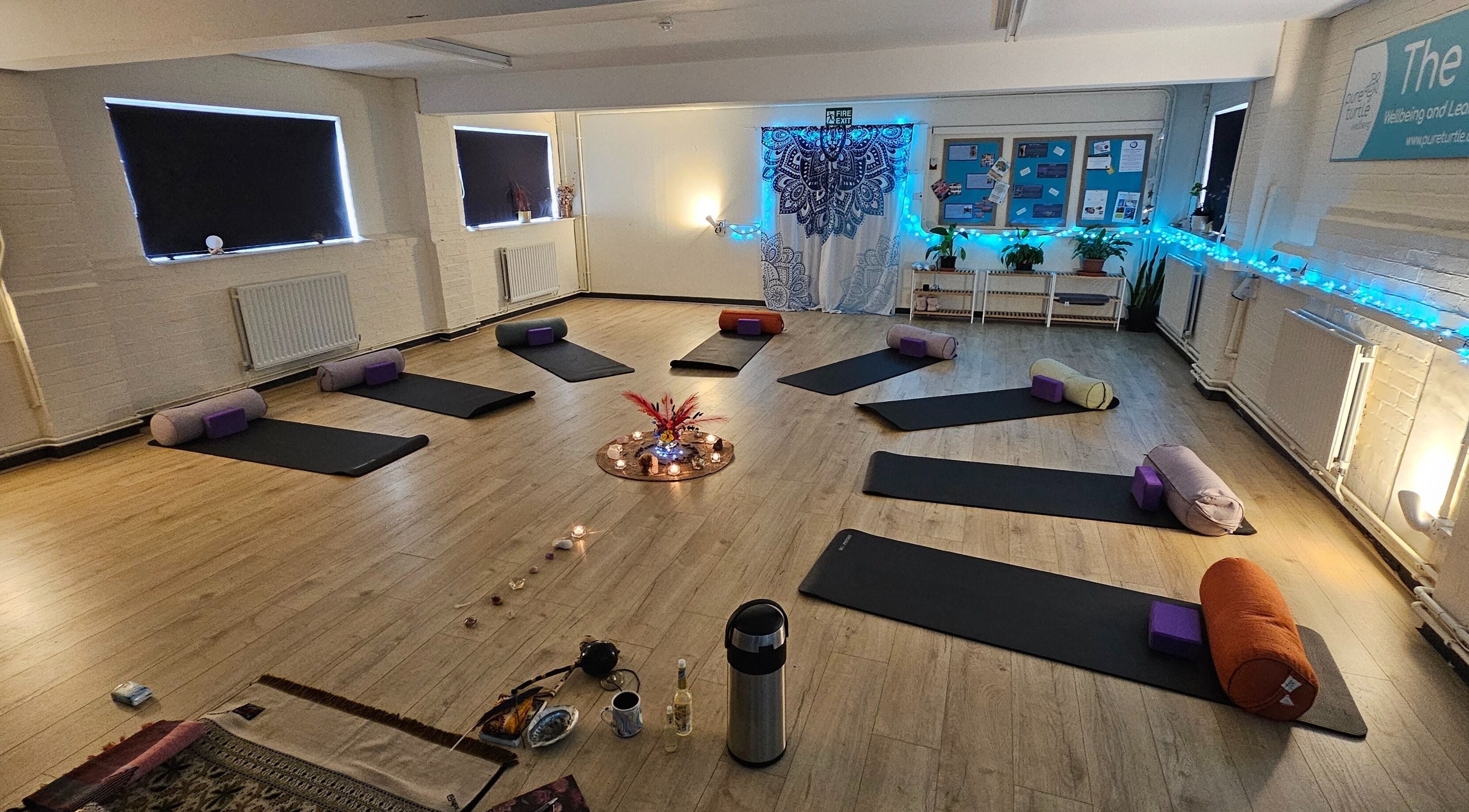 Peaceful yoga setup at Origin Wellbeing at The Pod, Burton Latimer, England, GB with mats and cushions.
