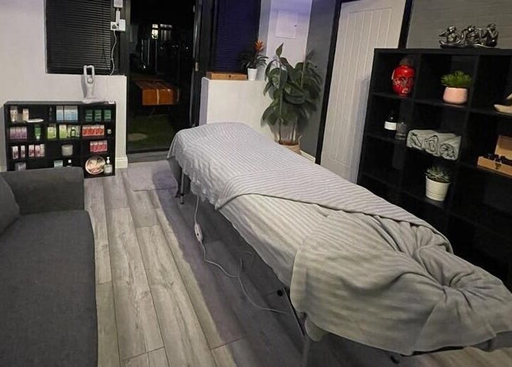 Calming therapy room at Beyond Bodyworks - Massage Essex, Aveley, England, GB with massage table and soothing decor.