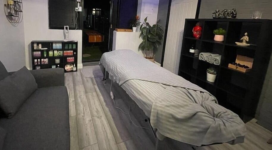 Calming therapy room at Beyond Bodyworks - Massage Essex, Aveley, England, GB with massage table and soothing decor.