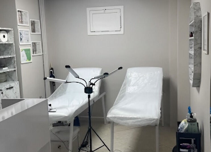 Treatment room at Ruby Glow Nails & Beauty Kadıköy, İstanbul, İstanbul, TR, featuring two beds and modern decor.