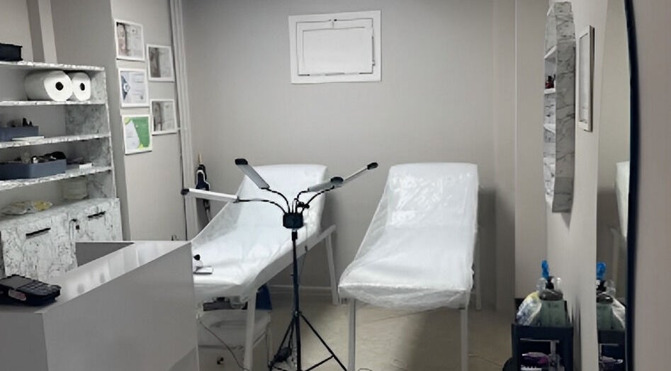 Treatment room at Ruby Glow Nails & Beauty Kadıköy, İstanbul, İstanbul, TR, featuring two beds and modern decor.