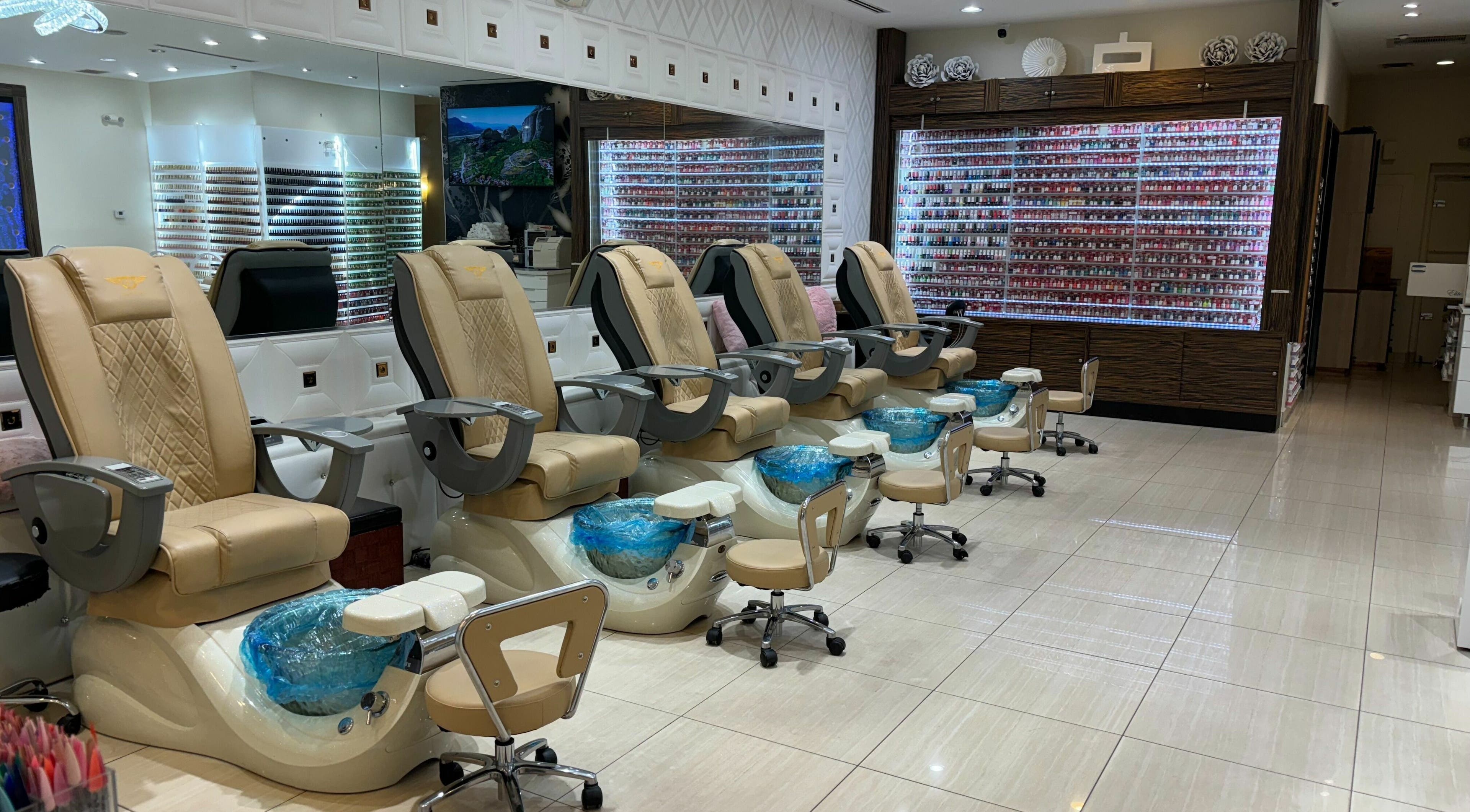 Elegant pedicure chairs at Elite Salon and Day Spa, Gilbert, Arizona, US, with a wide selection of nail polish.