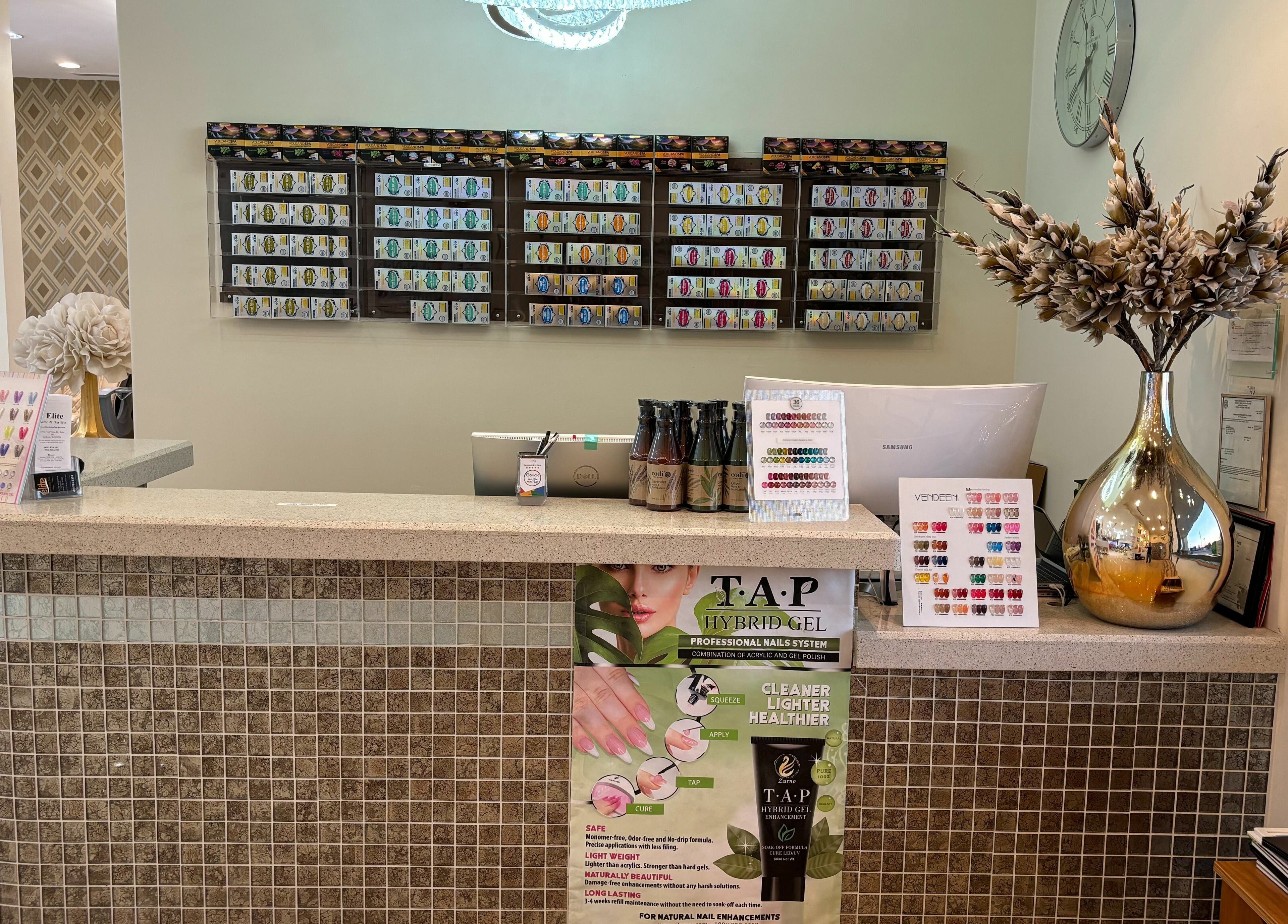 Elegant reception area of Elite Salon and Day Spa in Gilbert, Arizona, US featuring nail color displays and decor.