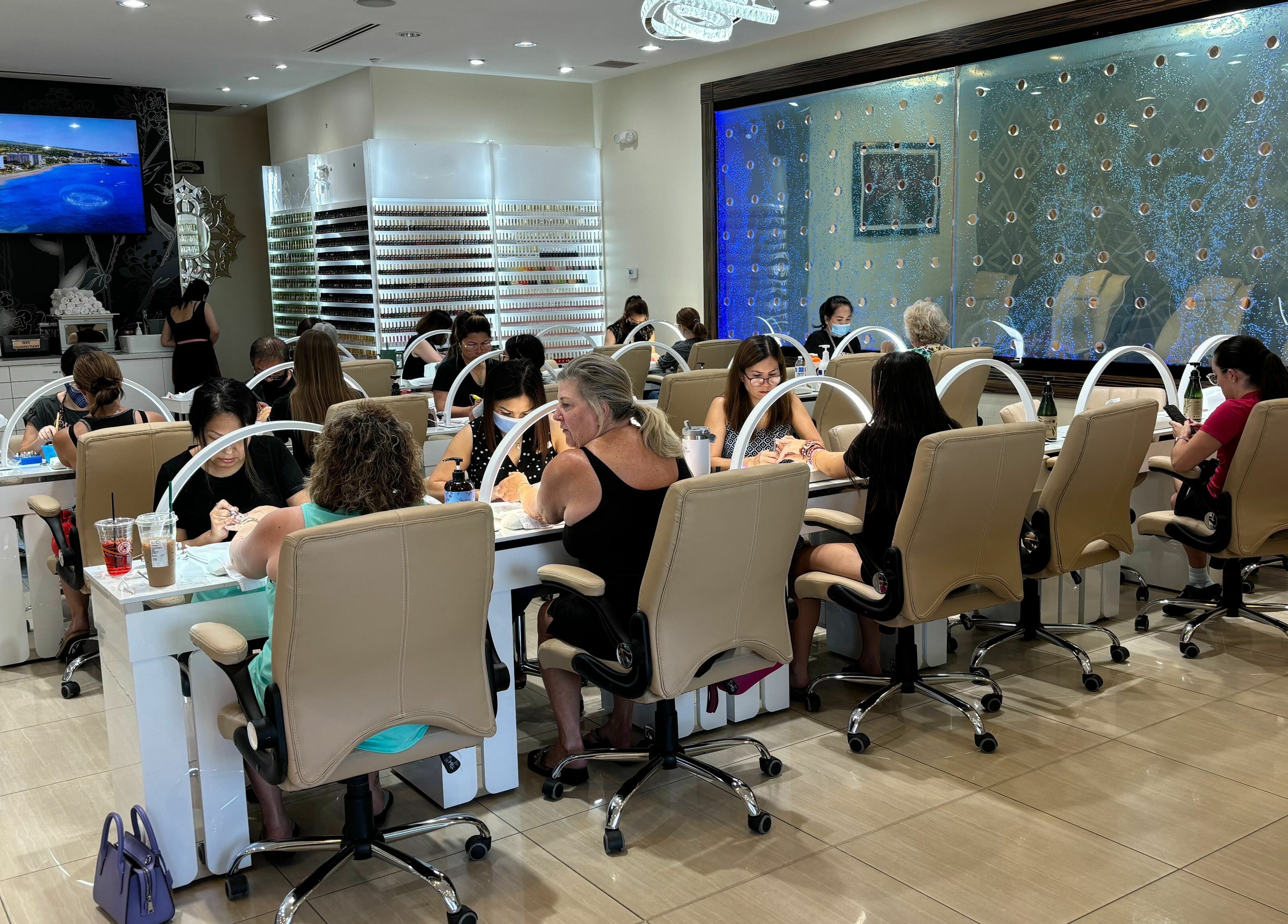 Guests enjoying manicures at Elite Salon and Day Spa in Gilbert, Arizona, US in a stylish, modern setting.