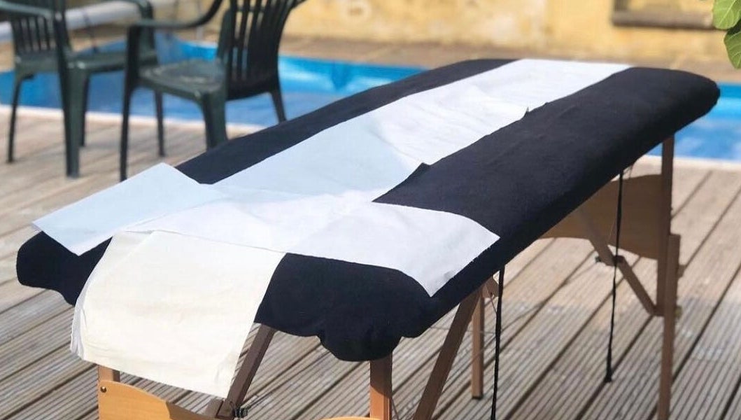 Spa treatment table at Casa Prado Mobile, London, England, GB, set by a serene poolside.