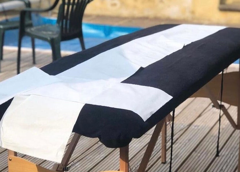 Spa treatment table at Casa Prado Mobile, London, England, GB, set by a serene poolside.