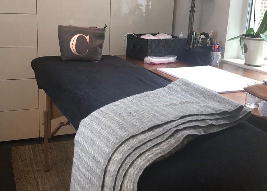 Massage table in Casa Prado Mobile, London, England, GB with natural light and serene ambiance.